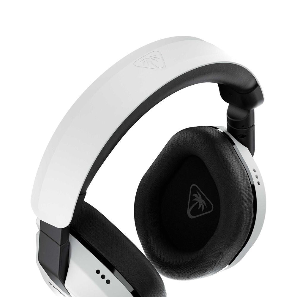 Close-up of a white and black over-ear gaming headset earcup with padded cushion