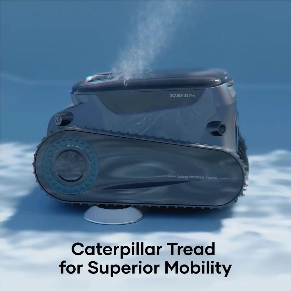 Cordless robotic pool cleaner on water, dark gray body with turquoise side wheel