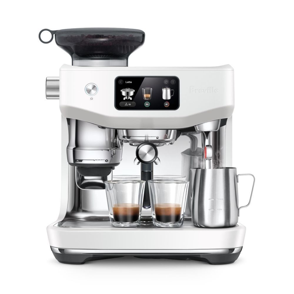 Sea salt manual espresso machine with milk jug on right and dual cup area