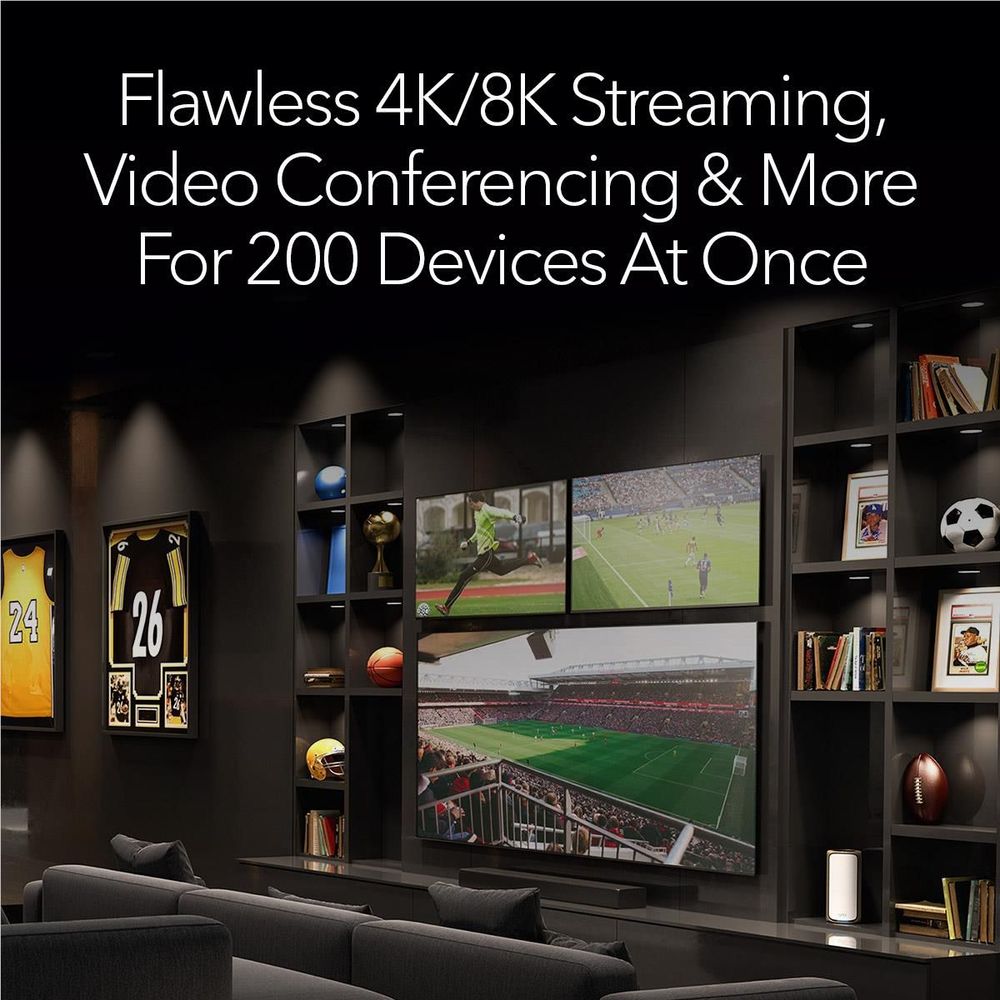 Orbi WiFi 7 mesh router on a shelf powering multiple TVs and streaming