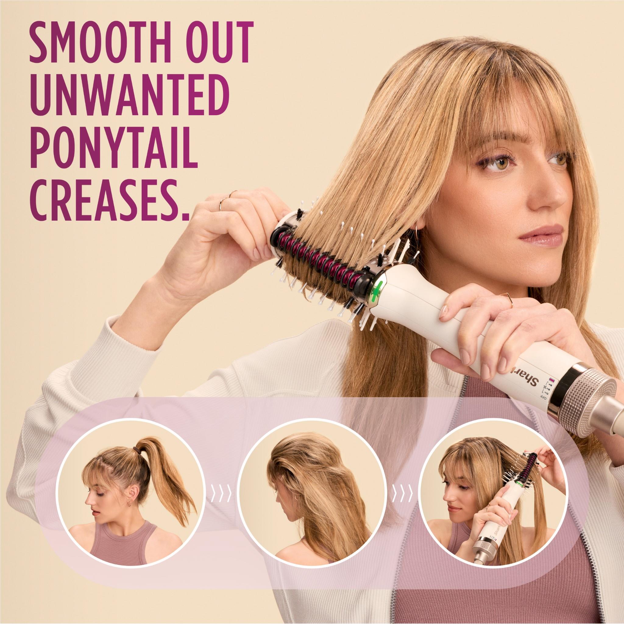 Heated comb straightener used to smooth long hair near the scalp