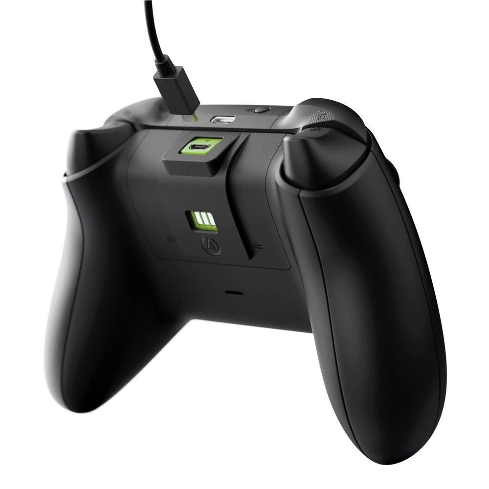 Xbox controller with PowerA charging module on top, black with green status lights
