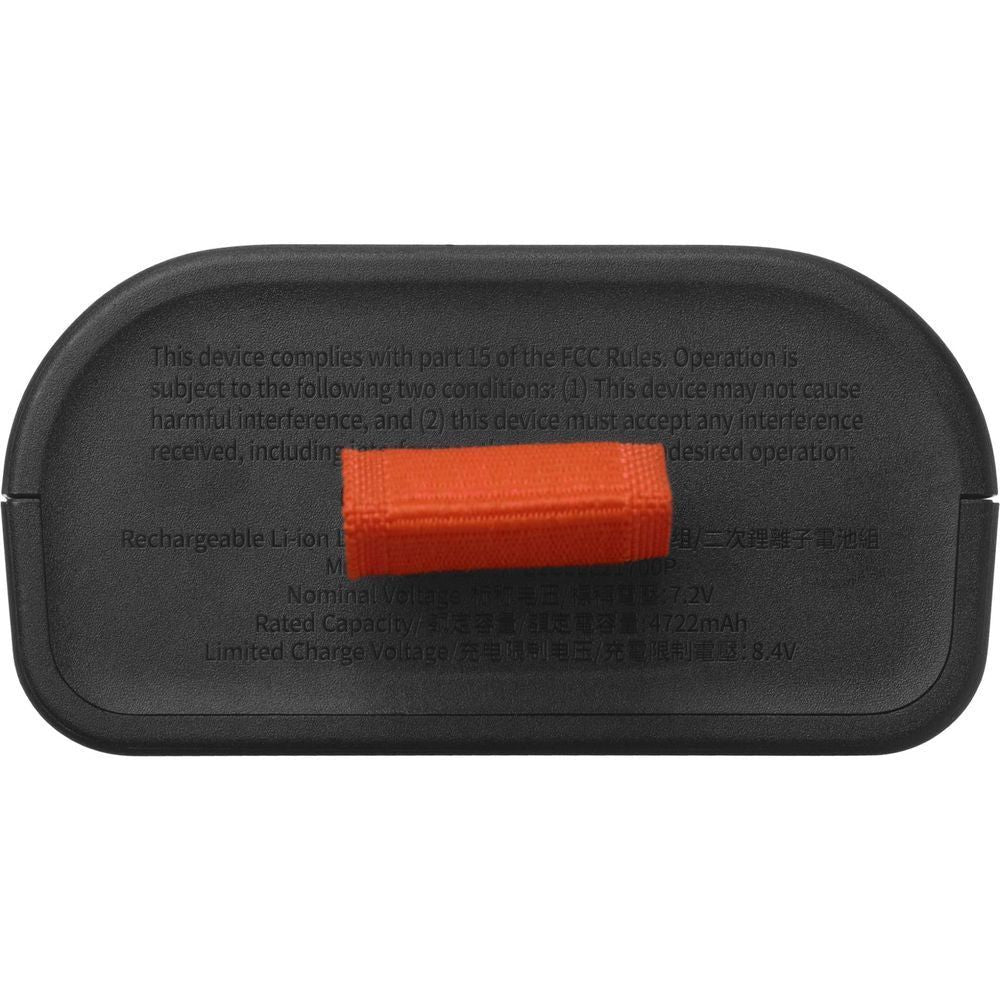 Black JBL Battery 200 underside with orange strap and regulatory text