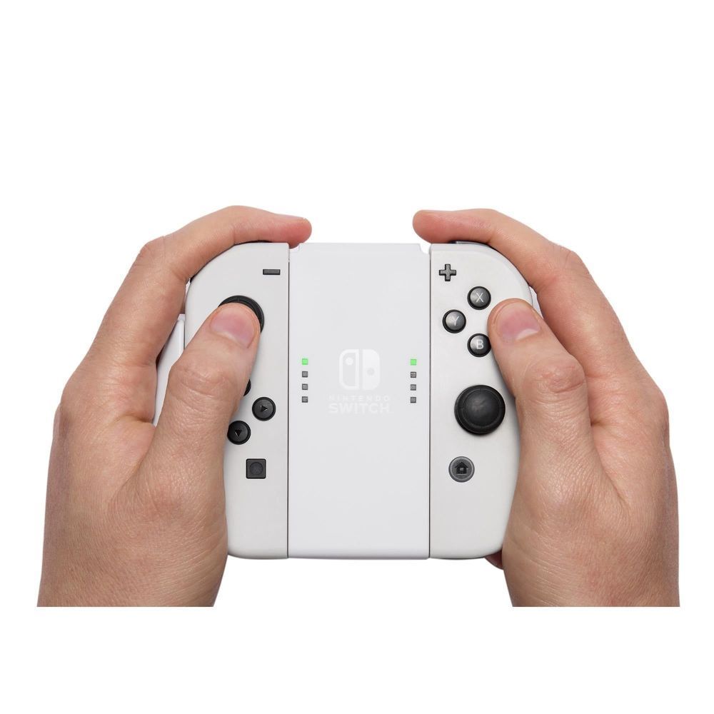 Joy-Con comfort grip held in two hands, showing thumbstick and button layout