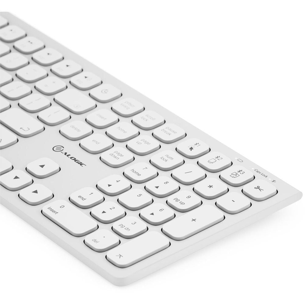 White wireless keyboard, angled view of sculpted keys and arrow cluster