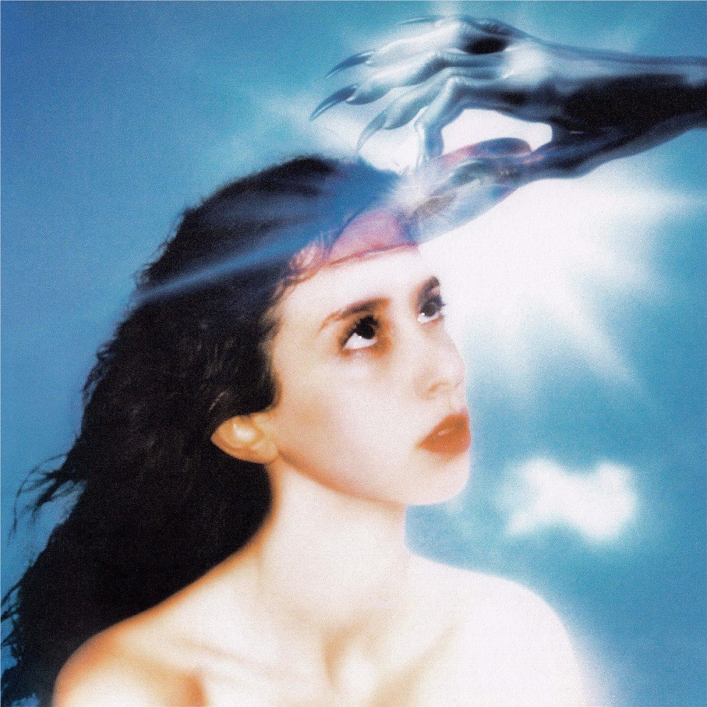 Imaginal Disk album cover by Magdalena Bay: woman portrait, dark hair, blue overlay