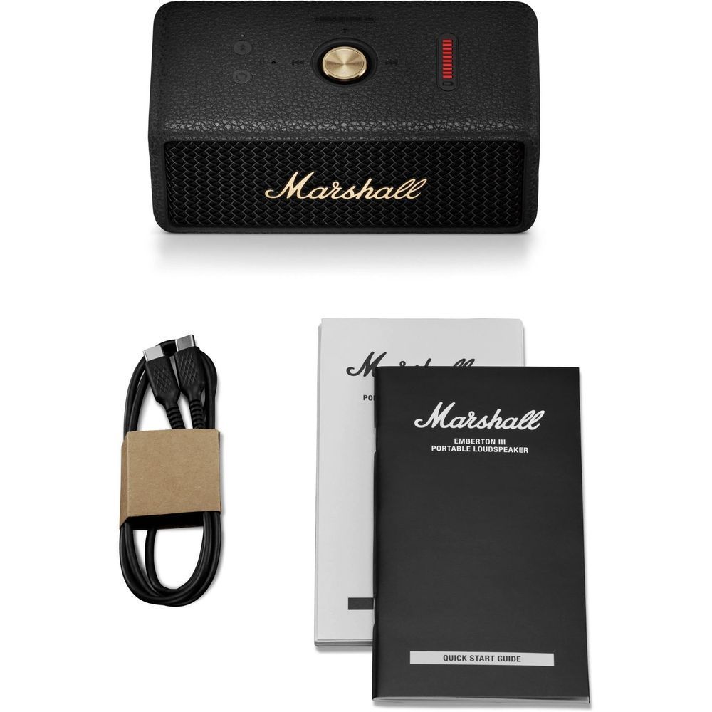 Black portable Bluetooth speaker with included quick start guide and power cable