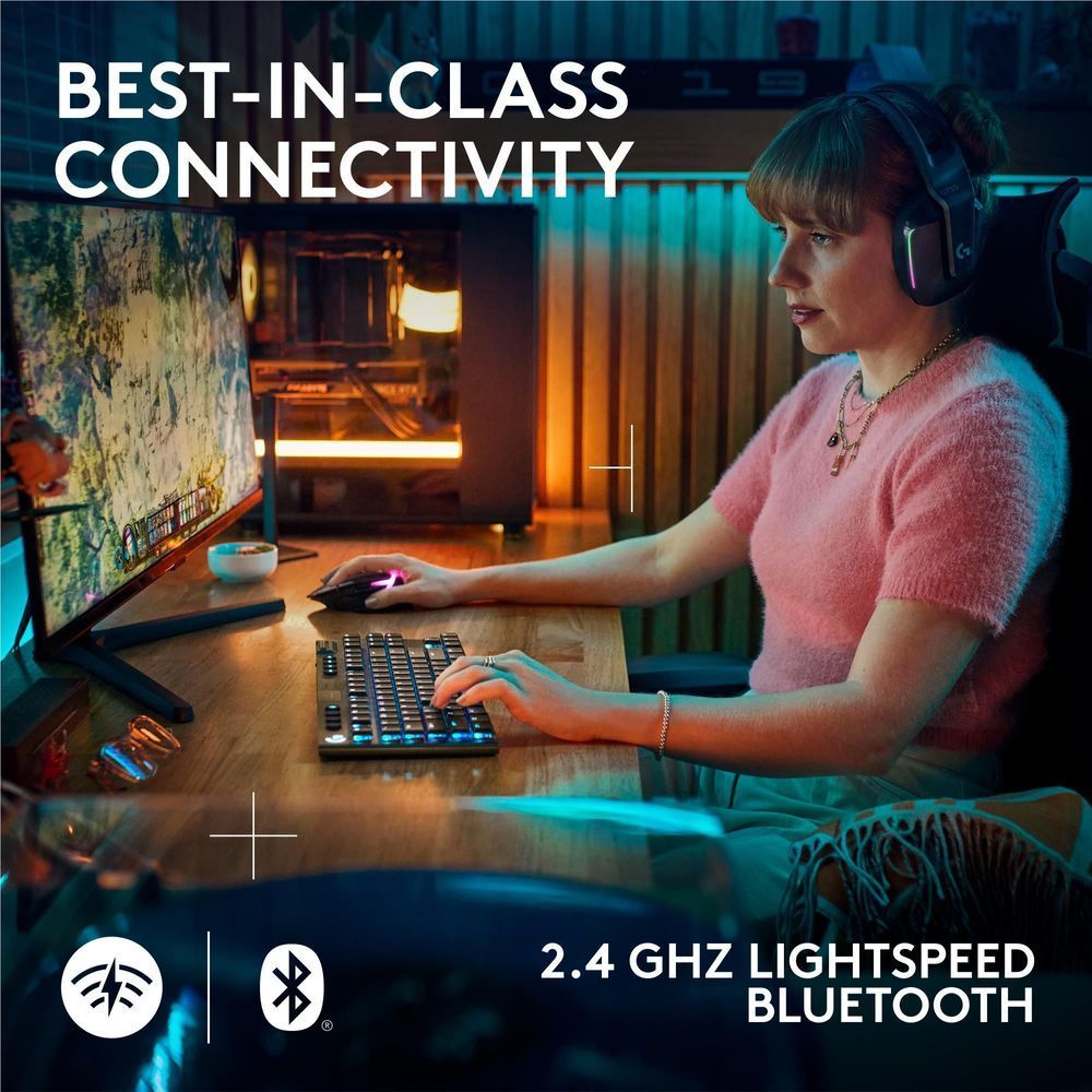 Black low-profile wireless gaming keyboard with RGB lighting on desktop