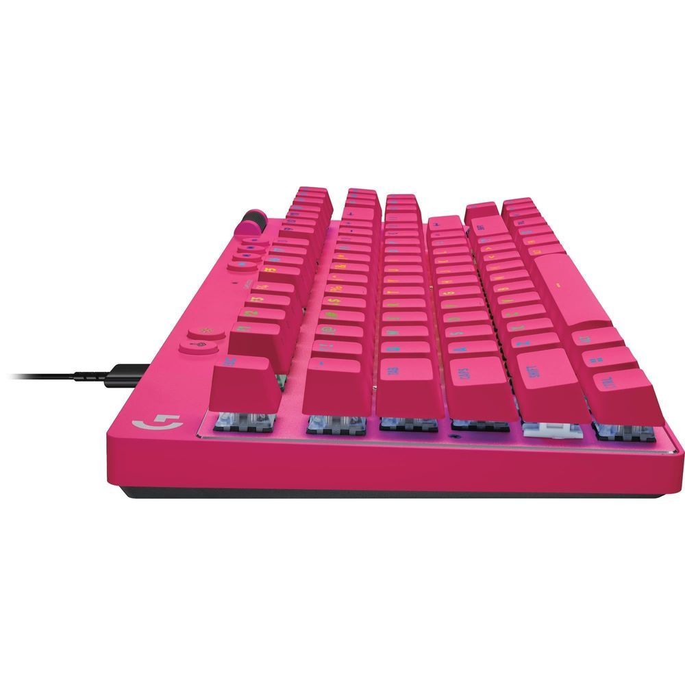 Magenta mechanical keyboard close-up showing rows of magenta keycaps