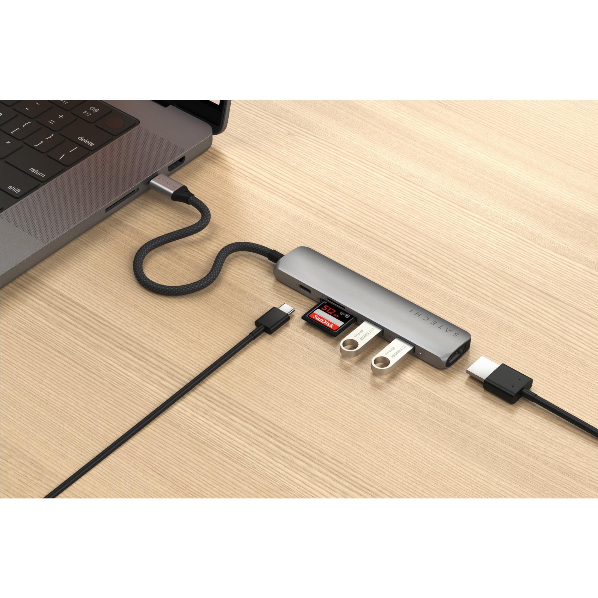 USB-C multiport hub connected to laptop with multiple accessory adapters plugged in