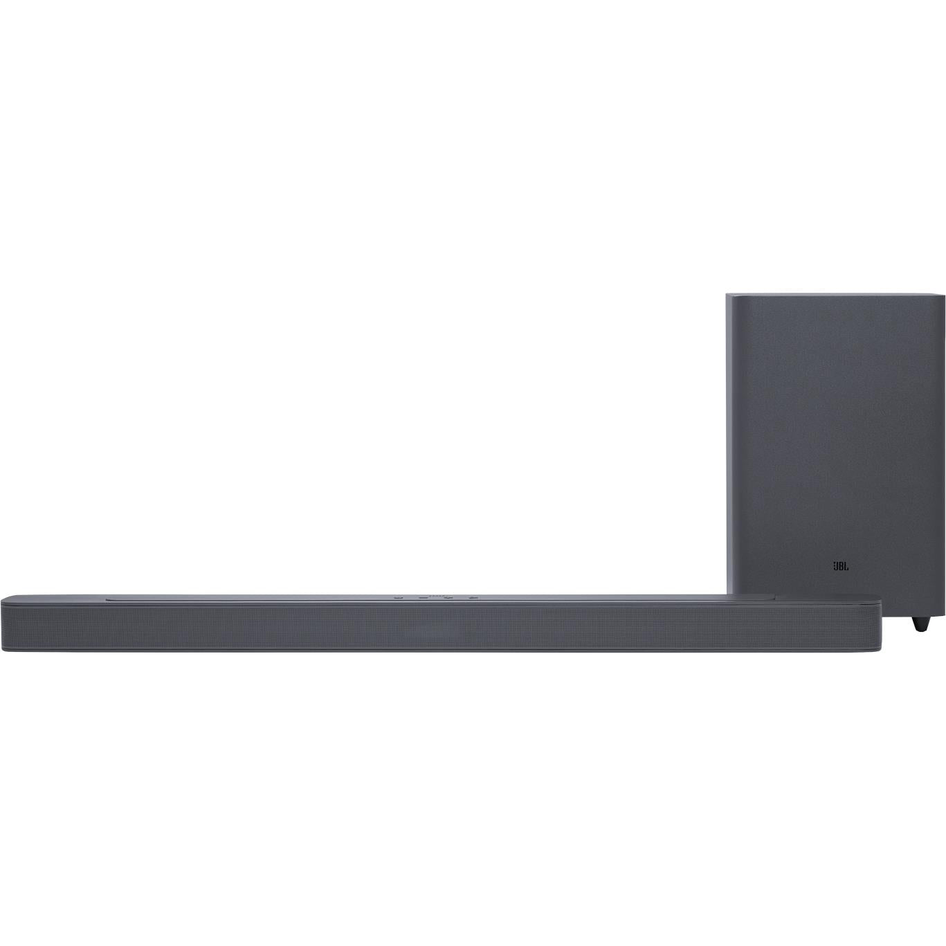 Black soundbar with raised front profile and wireless subwoofer behind it.