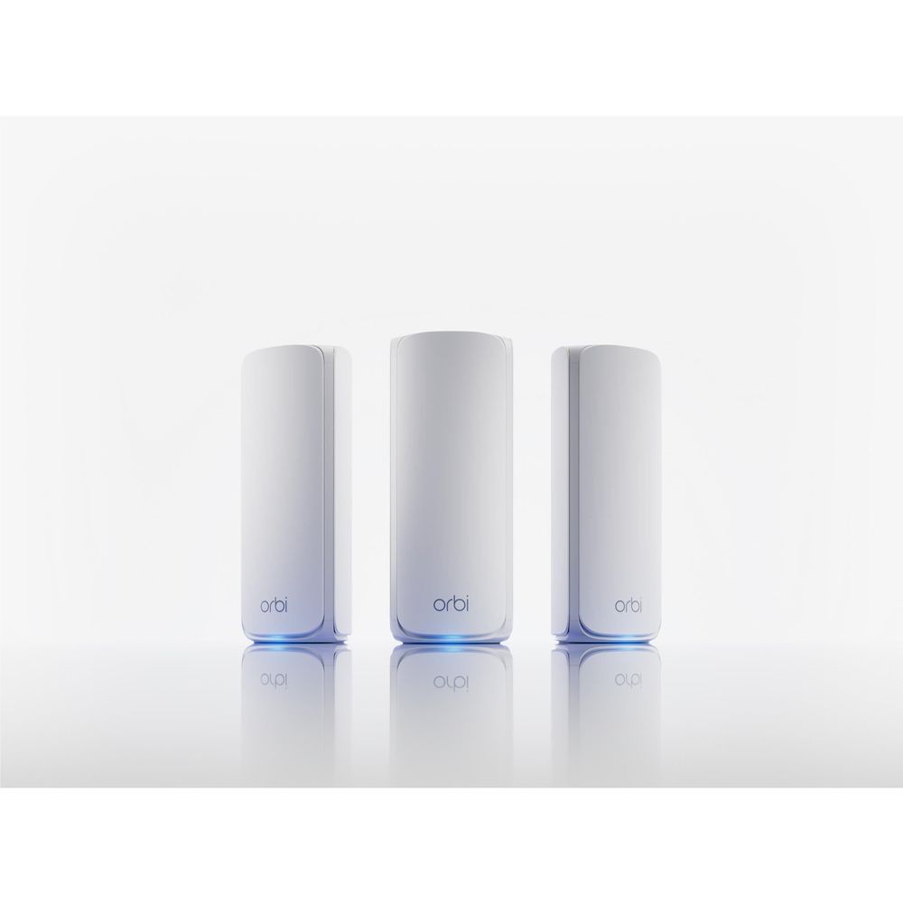 Three white Orbi tri-band mesh WiFi router pods on a light background