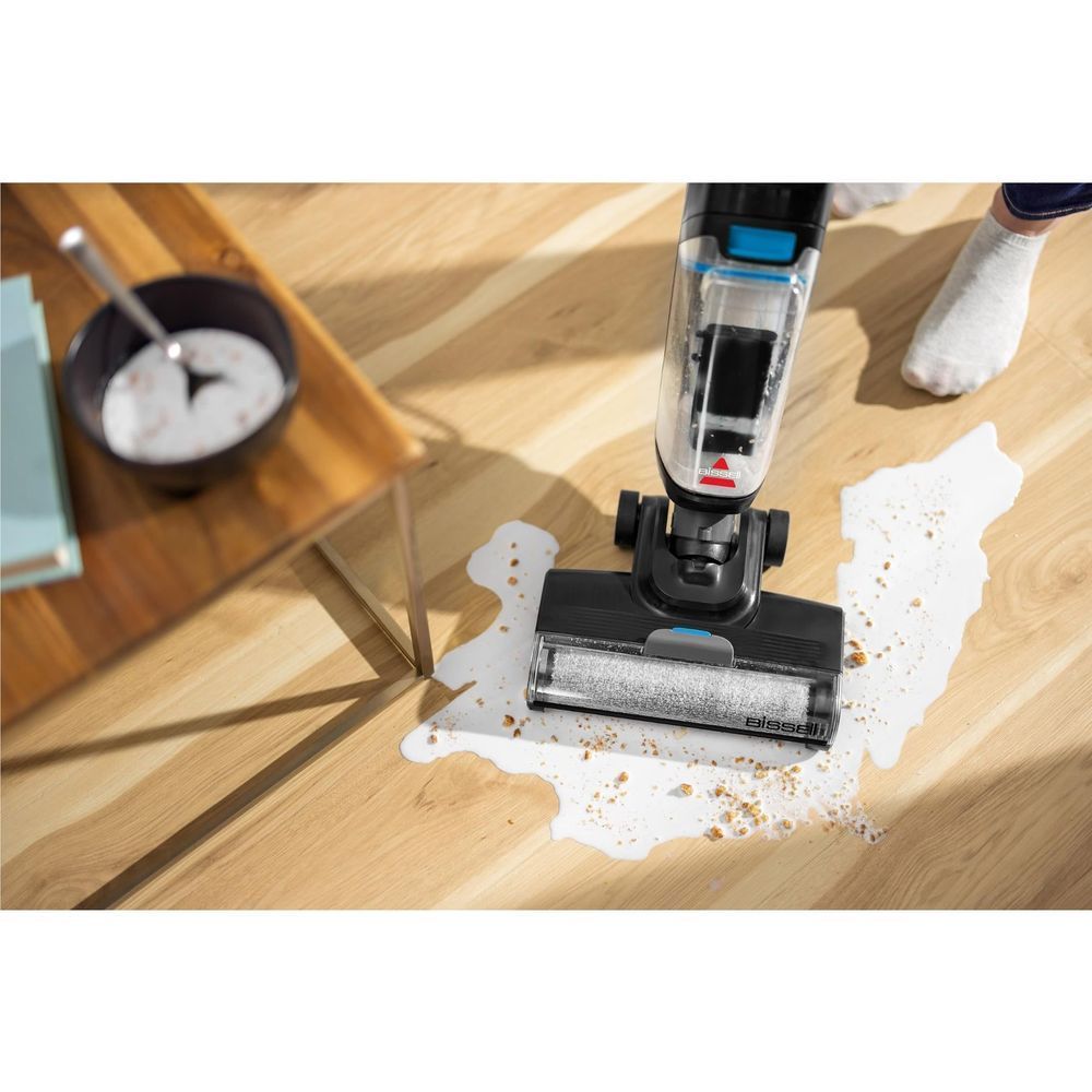 Wet and vacuum floor head cleaning wood with solution, black with blue tank.