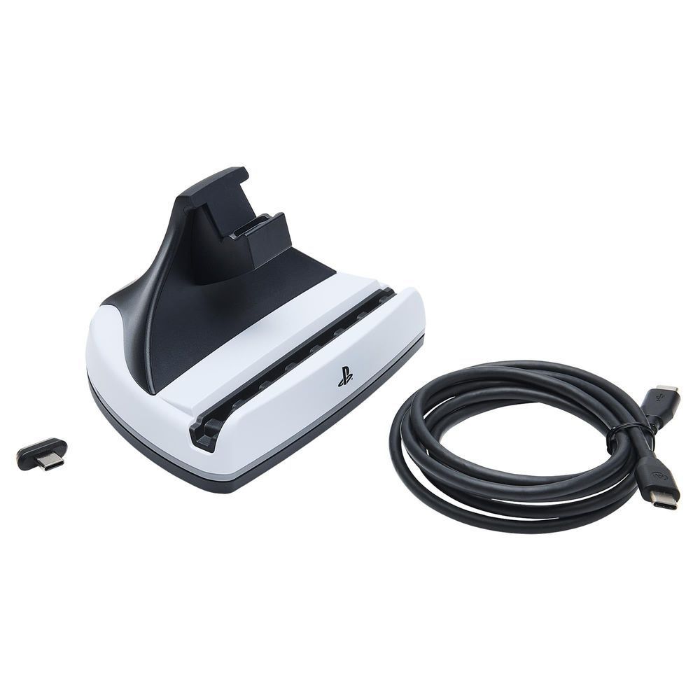 Charging station dock with cable and adapter pieces beside the white base