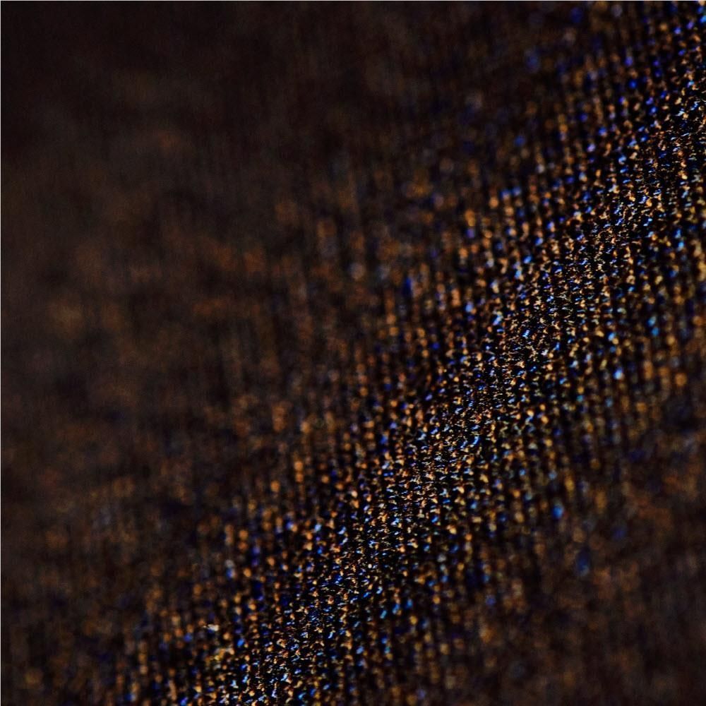 Close-up of dark basalt mosaic weave fabric texture