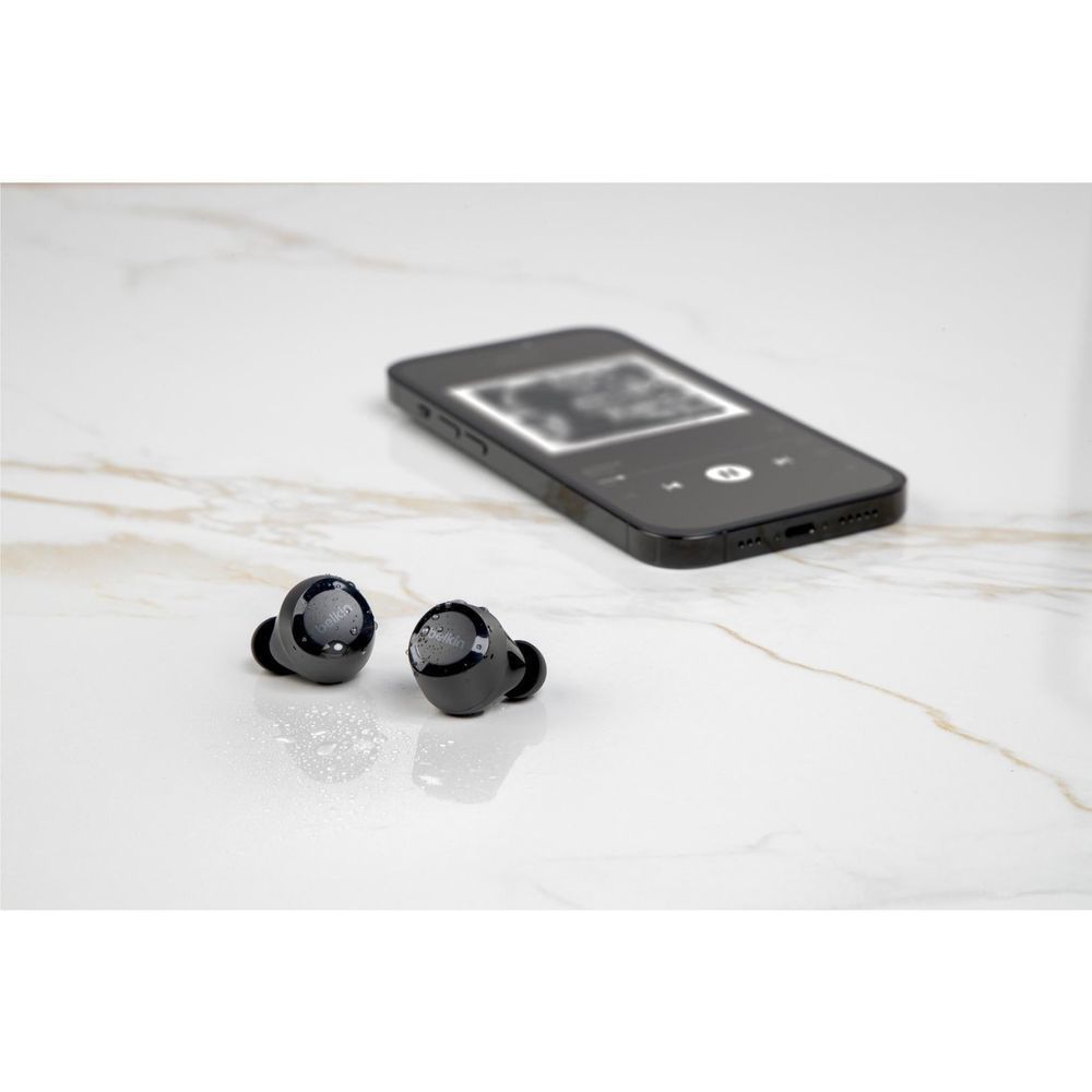 Belkin SoundForm Bolt 2 black true wireless in-ear earbuds lying on a surface