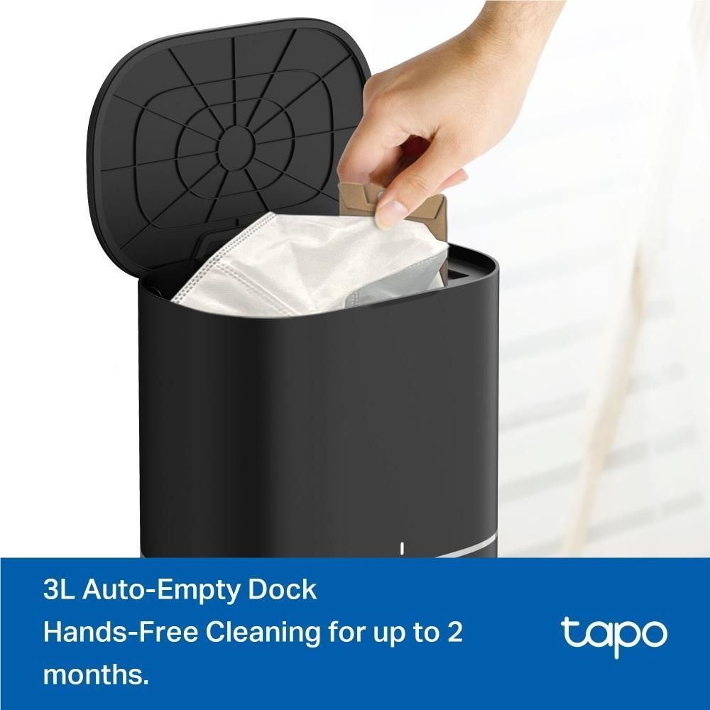Auto-empty dock with open top and dust bag being lifted by hand