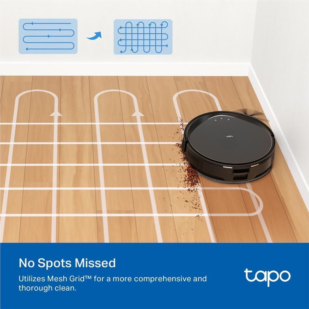 Black robot vacuum navigating a room with grid path lines near an indoor corner