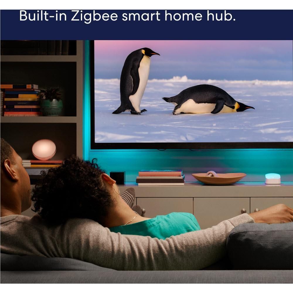 Mesh Wi-Fi router with built-in Zigbee smart home hub shown during TV viewing