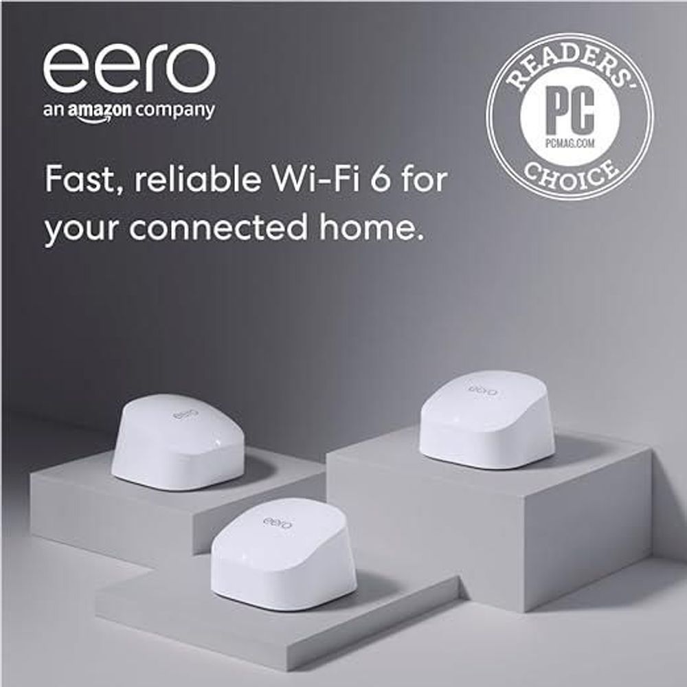 Three white eero mesh routers on display blocks, compact round dome with eero logo