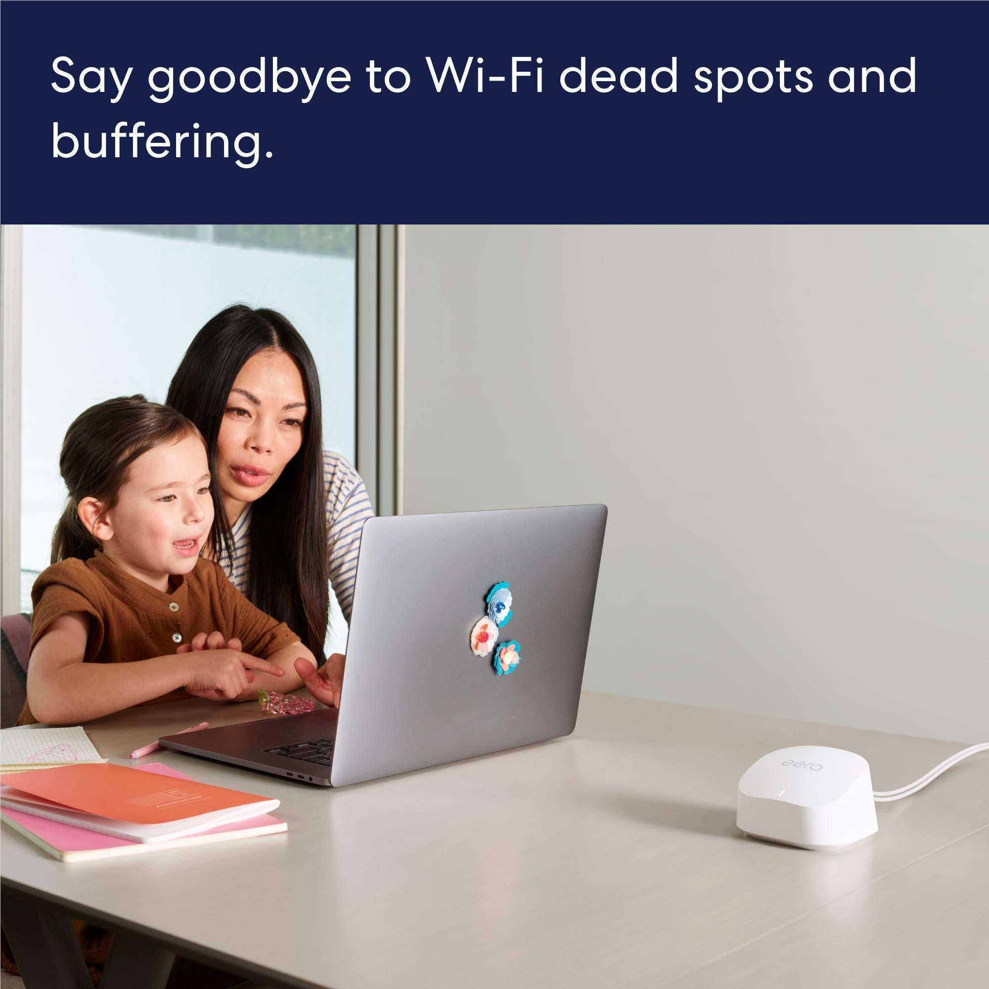 White eero mesh Wi-Fi router on table with visible power cable