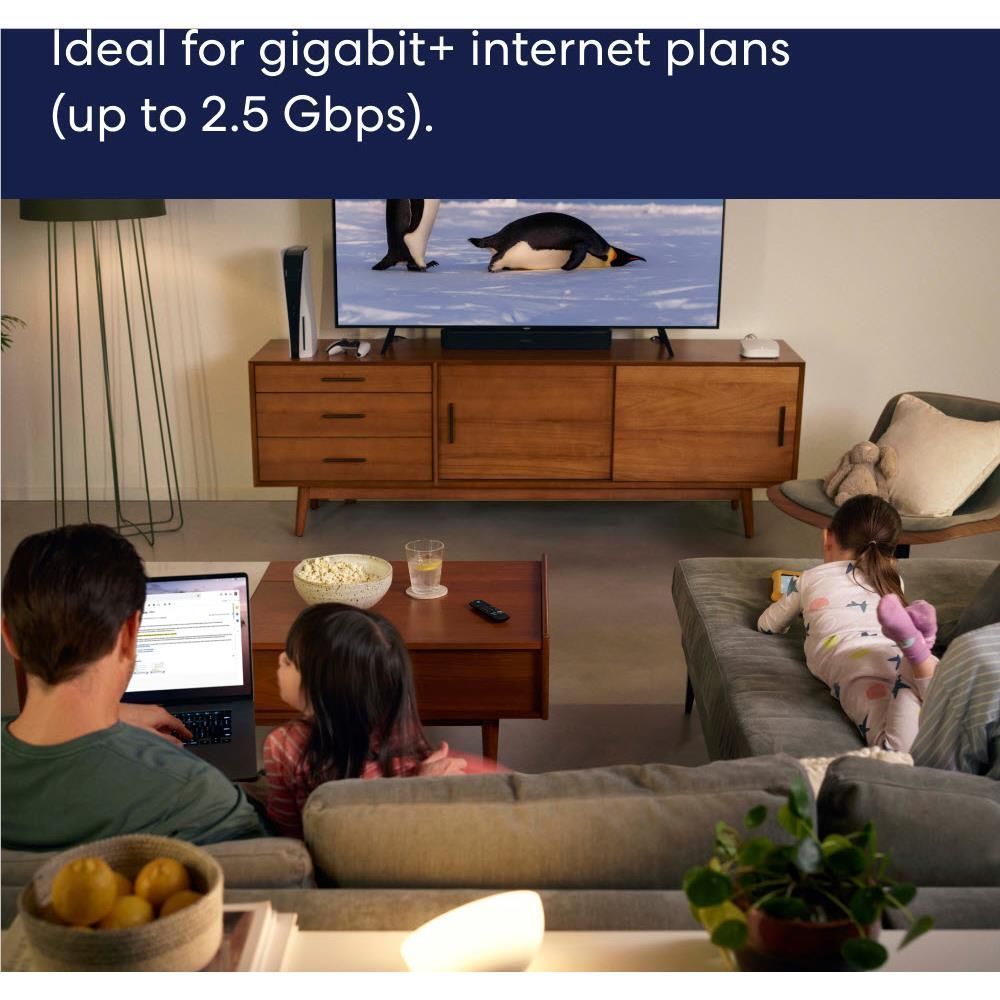 White eero mesh Wi-Fi router node on a living-room entertainment stand