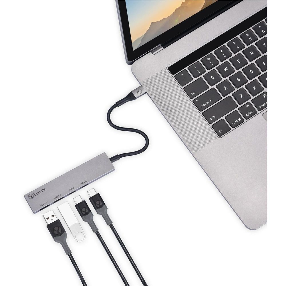 Bonelk space grey USB-C hub connected to a laptop keyboard