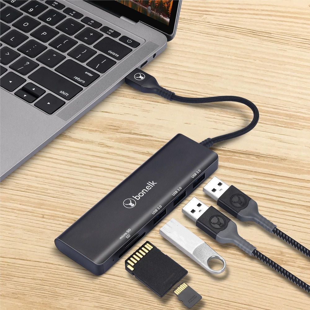 USB-A 3-port hub with SD card reader, black hub with inserted SD card and USB drives