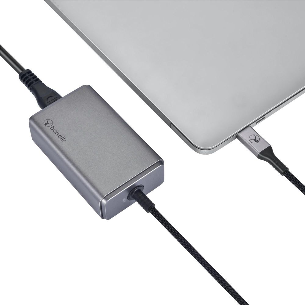 Space gray PD GaN desktop charger connected to a USB-C laptop