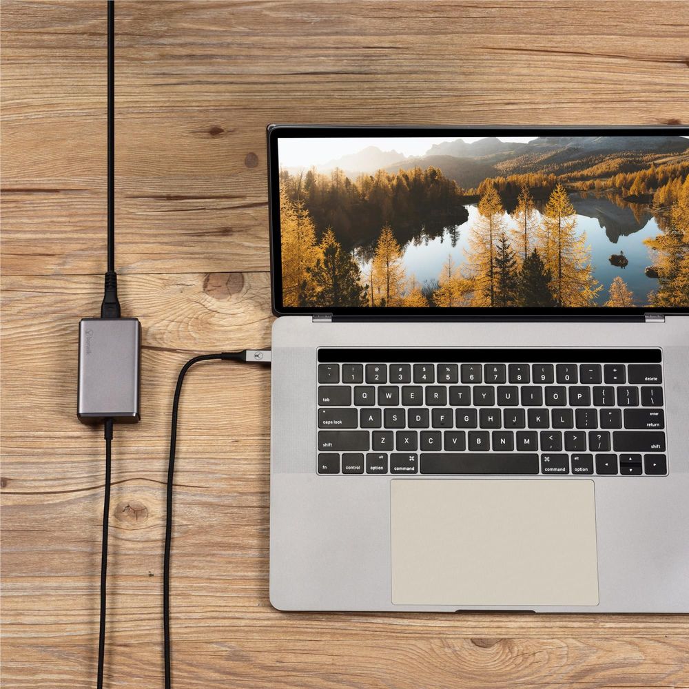 Space gray PD GaN charger connected to a laptop USB-C port on a desk