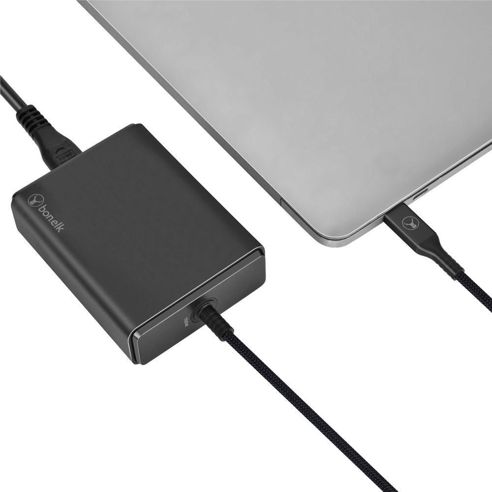 Black desktop charger with built-in cable, showing USB-C port and top branding