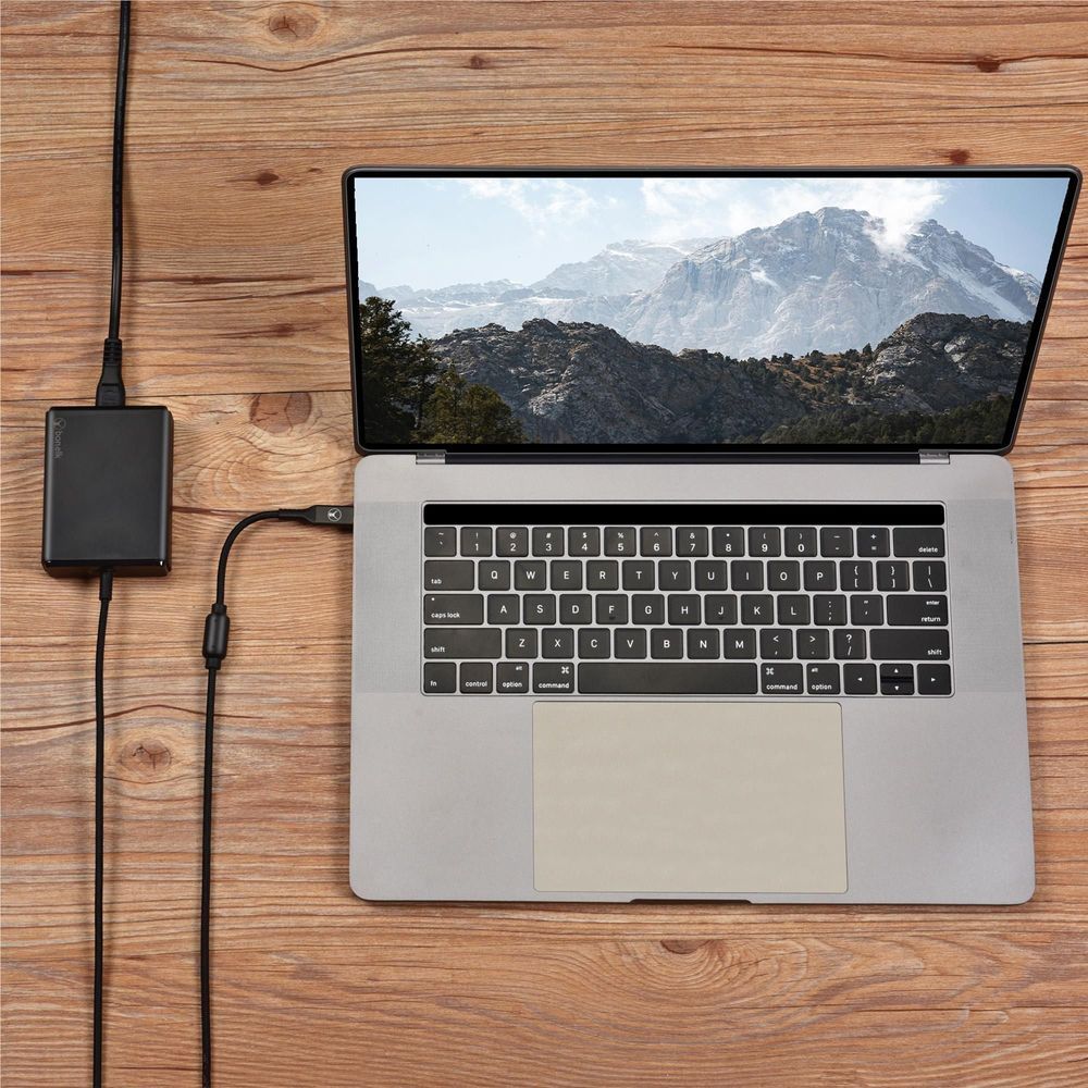 Black GaN desktop charger connected to laptop via USB-C cable
