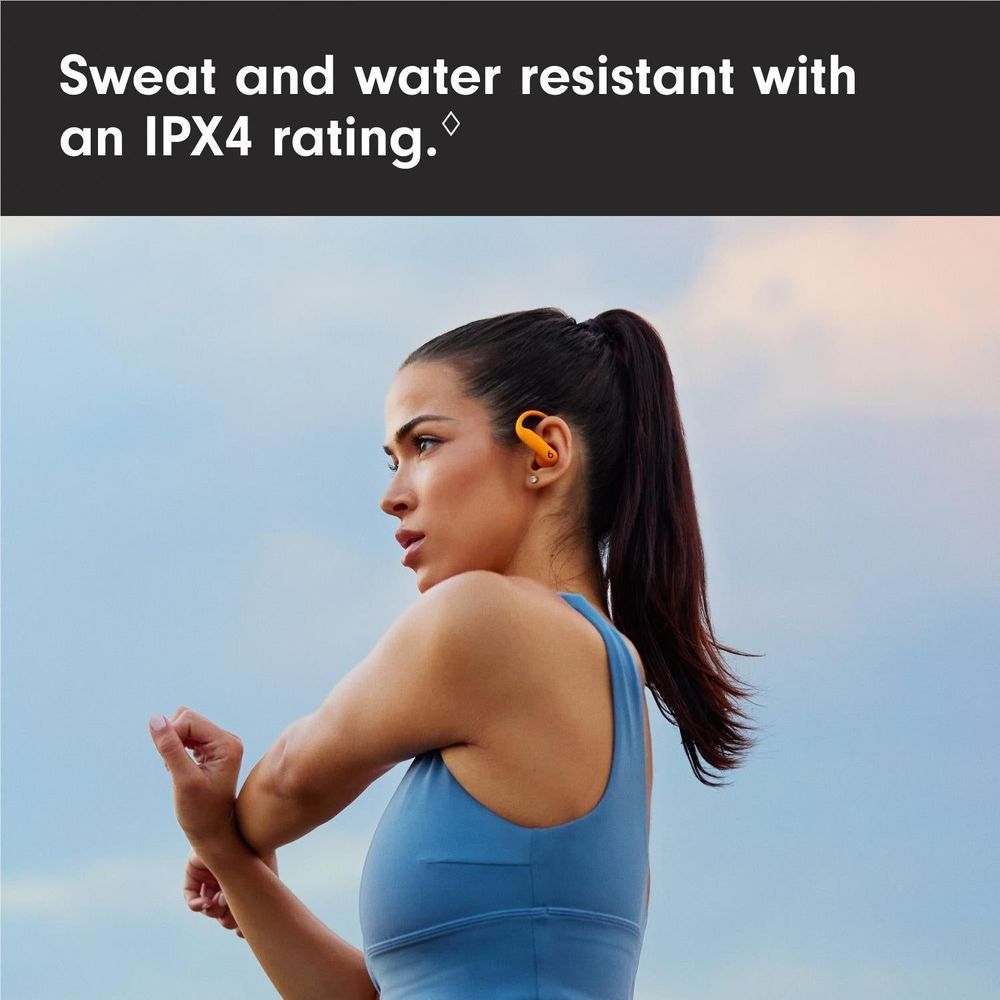 Electric orange earbuds worn in ear with secure-fit ear hook