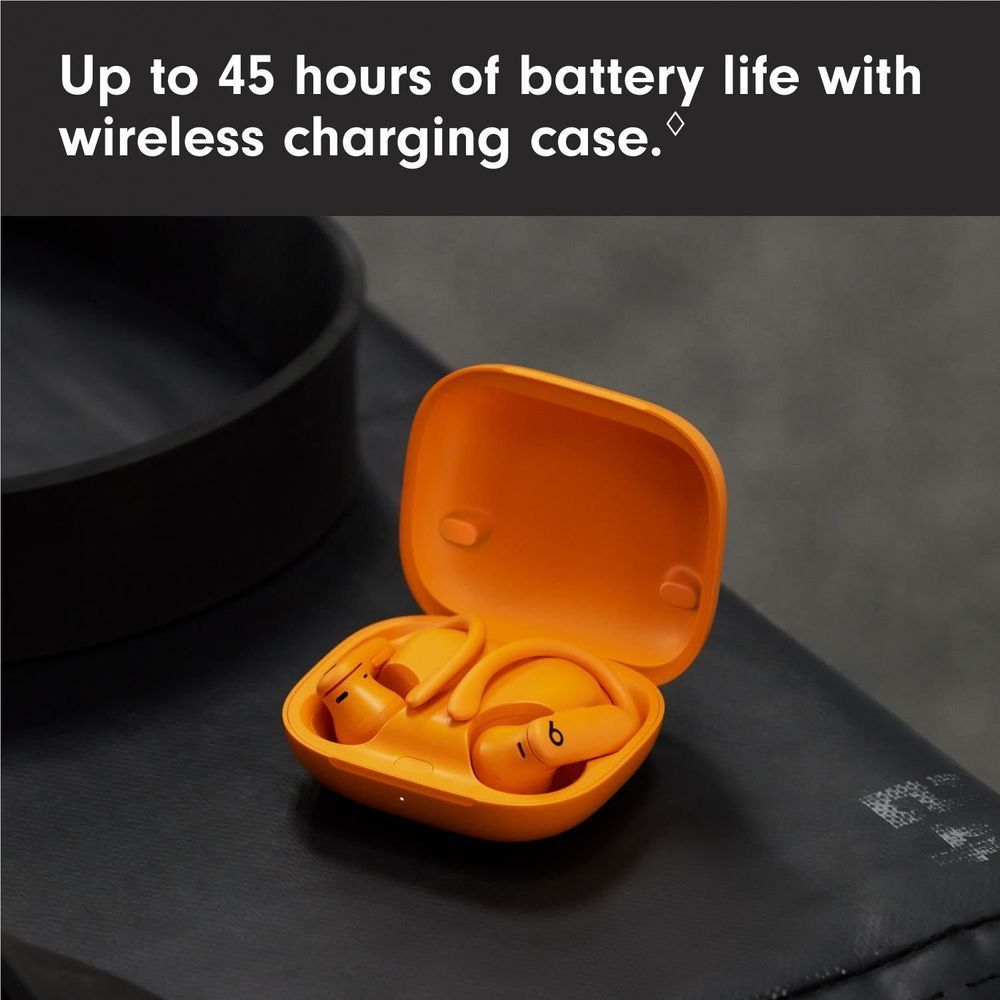 Electric orange charging case open with wireless earbuds inside