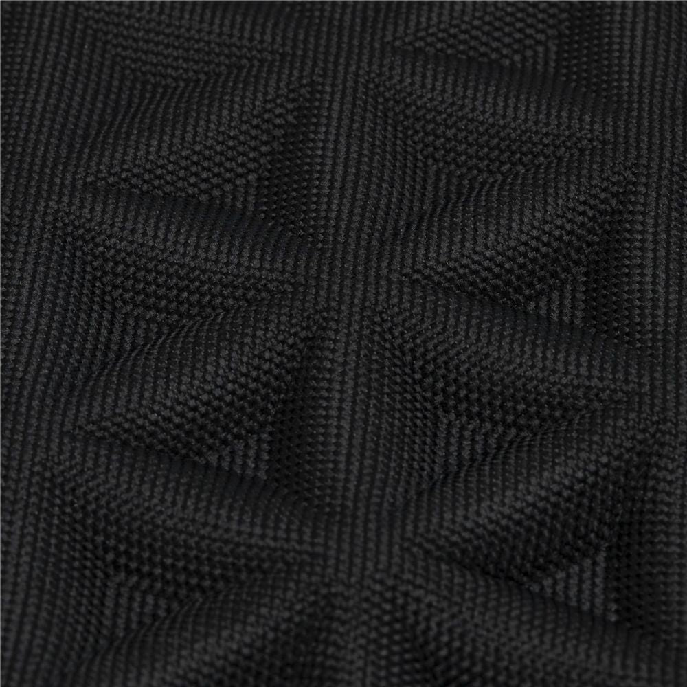 Black quilted diamond-texture fabric close-up on the laptop case