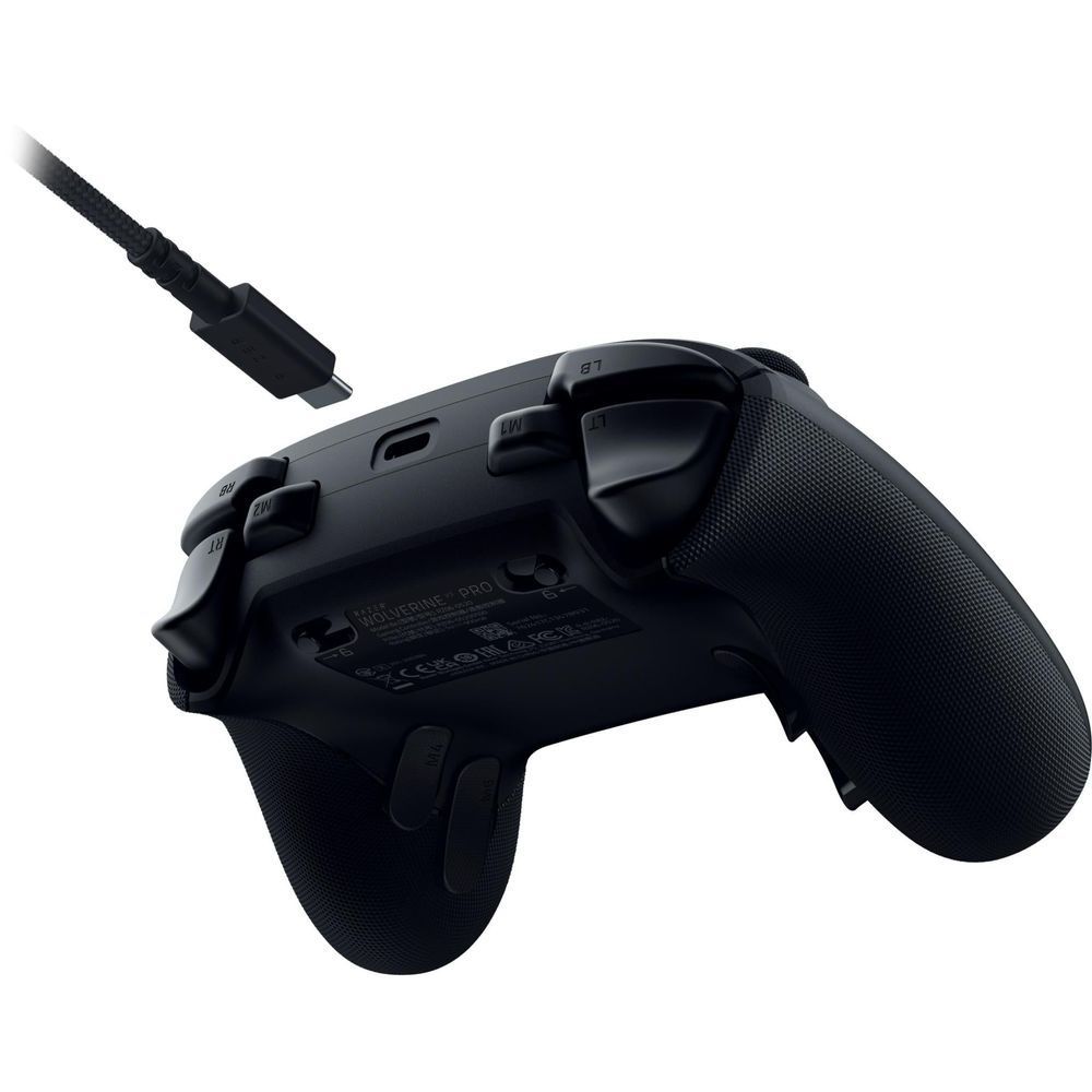 Black gaming controller rear with label, ports, and textured grip