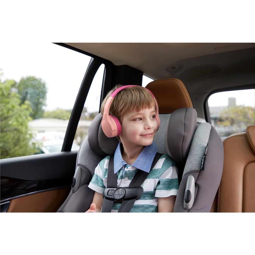 Pink kids wireless on-ear headphones on a child, padded ear cups over ears