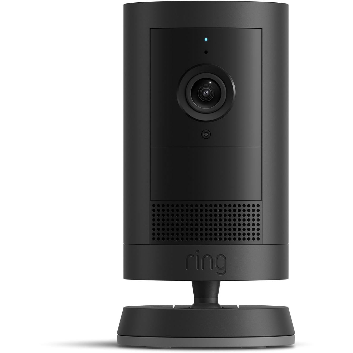Black outdoor battery security camera with lens and speaker grille, standing on base