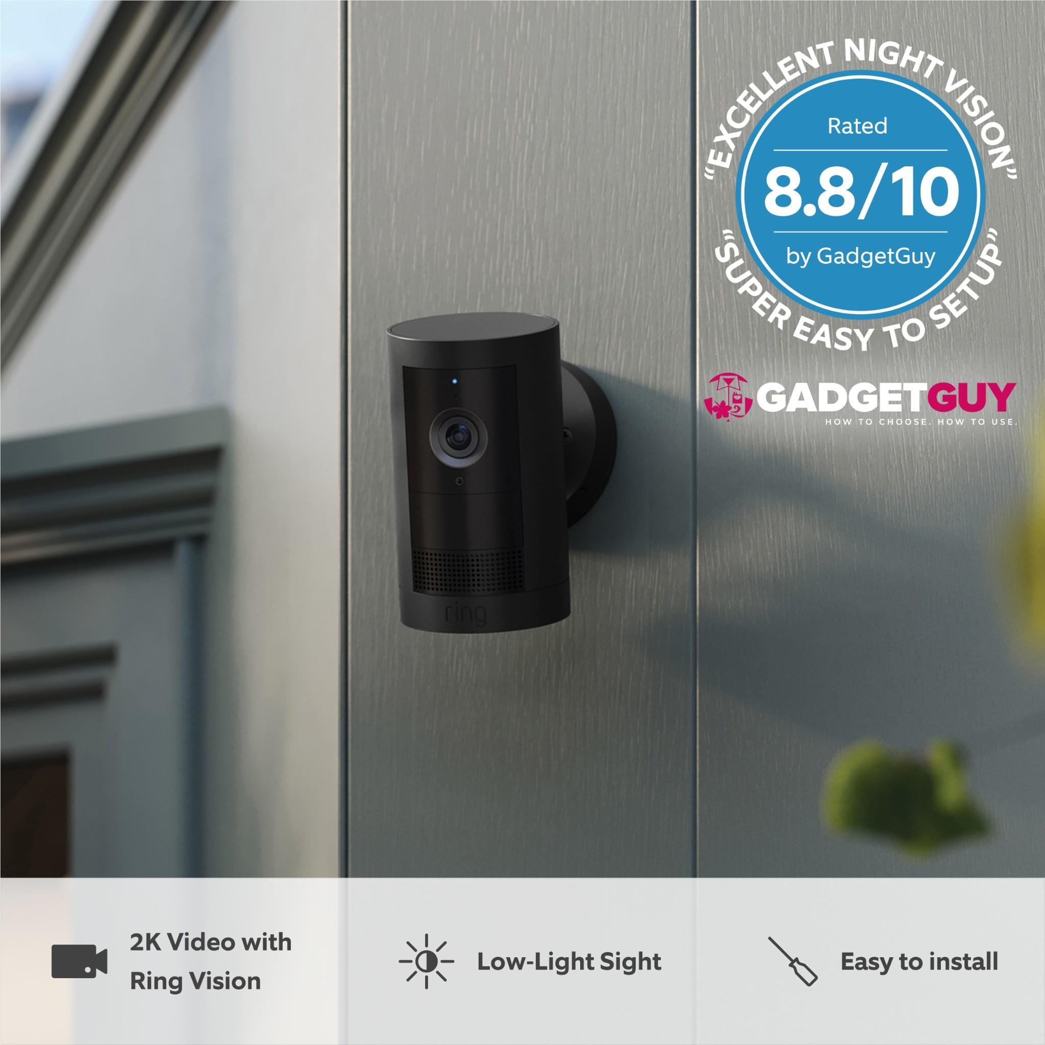 Wall-mounted black outdoor security camera with small indicator light