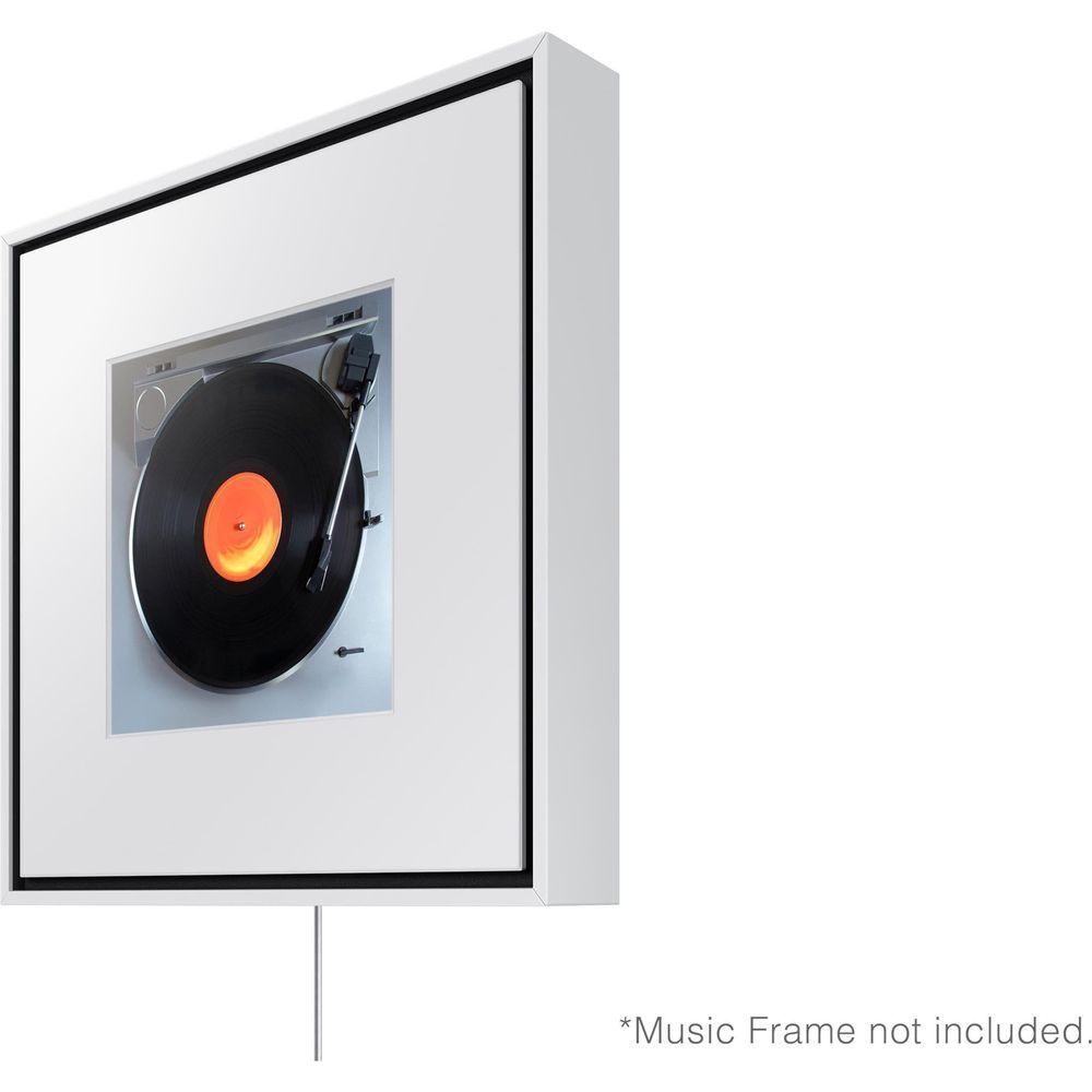 White bezel frame with black inner trim and small hanging cord, side view