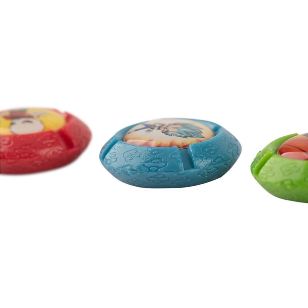 Three character-themed controller grips in red, blue, and green with circular design
