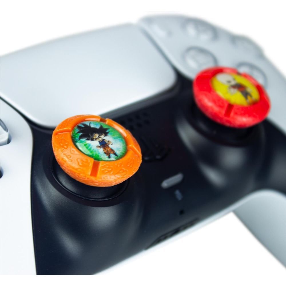 Orange and red character controller grips attached to a black game controller