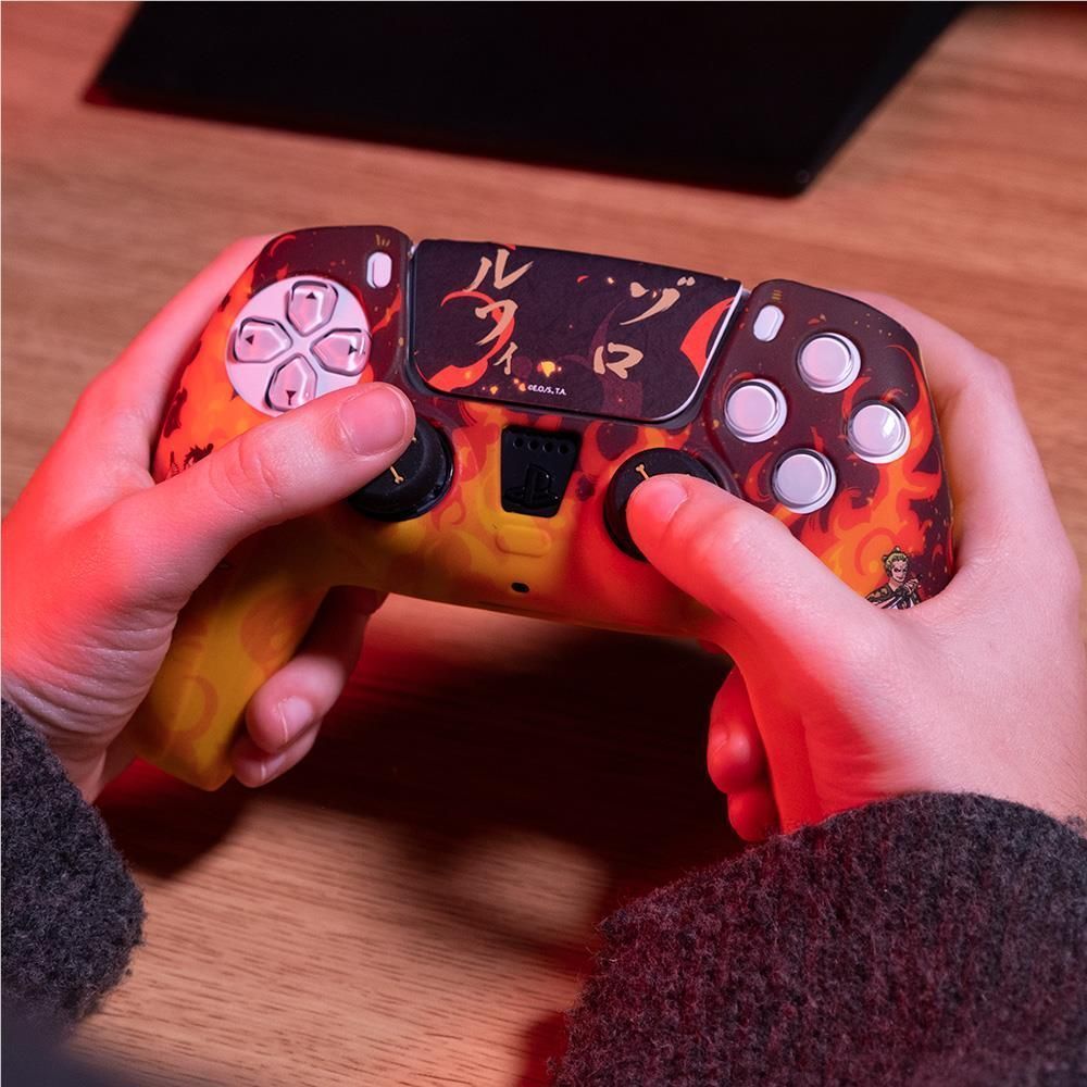 Fire-themed PS5 controller custom kit held in hands with flame orange-yellow design
