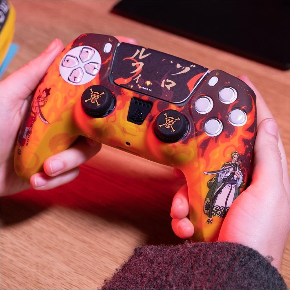 Close-up of fire PS5 controller custom kit with flame orange-yellow body and black touchpad