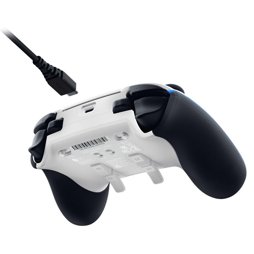 White controller with black grip handles and connected cable on back side