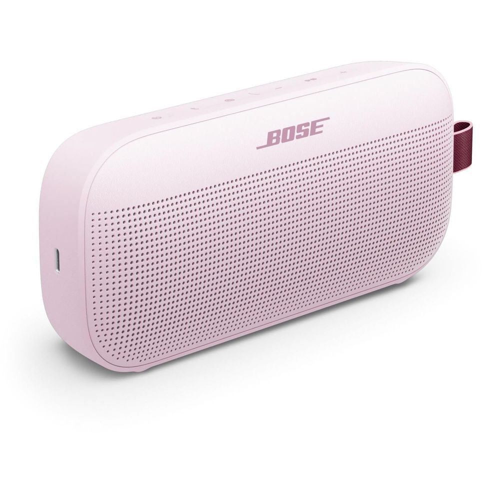 Petal pink Bose portable speaker side view with speaker grille and buttons
