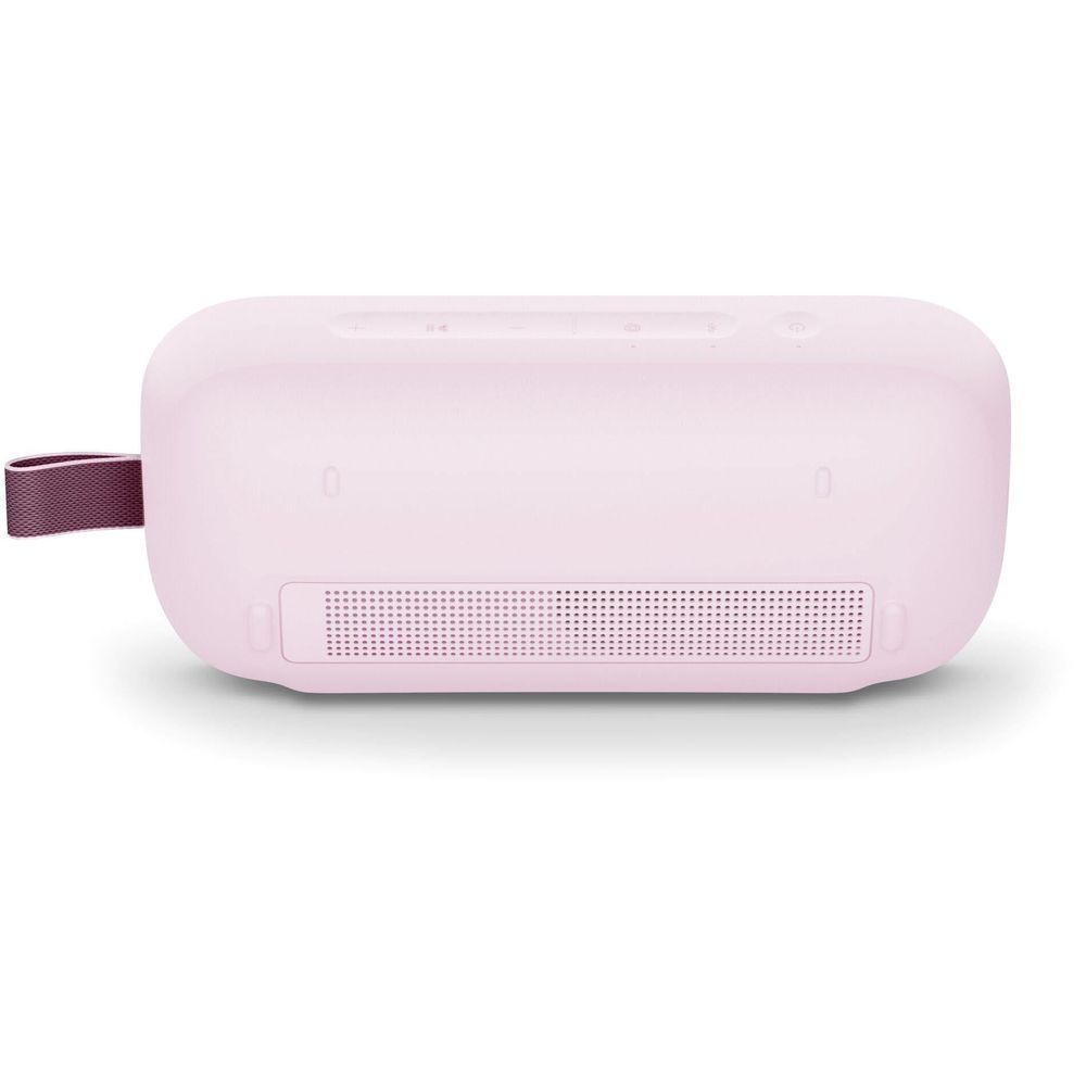 Petal pink Bose portable speaker back view with grille panel and strap