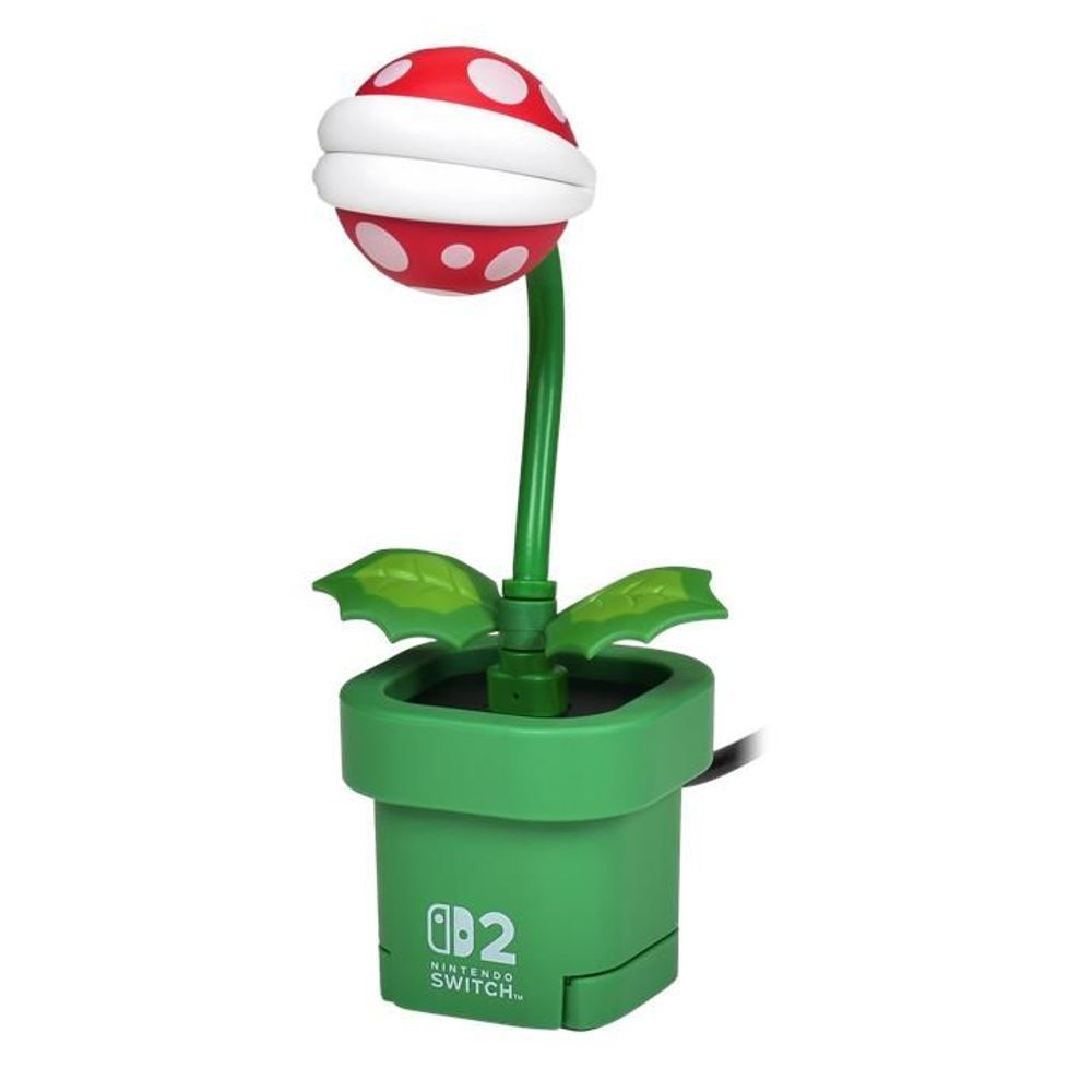 Piranha plant camera accessory with red white head, green stem, and open green pot