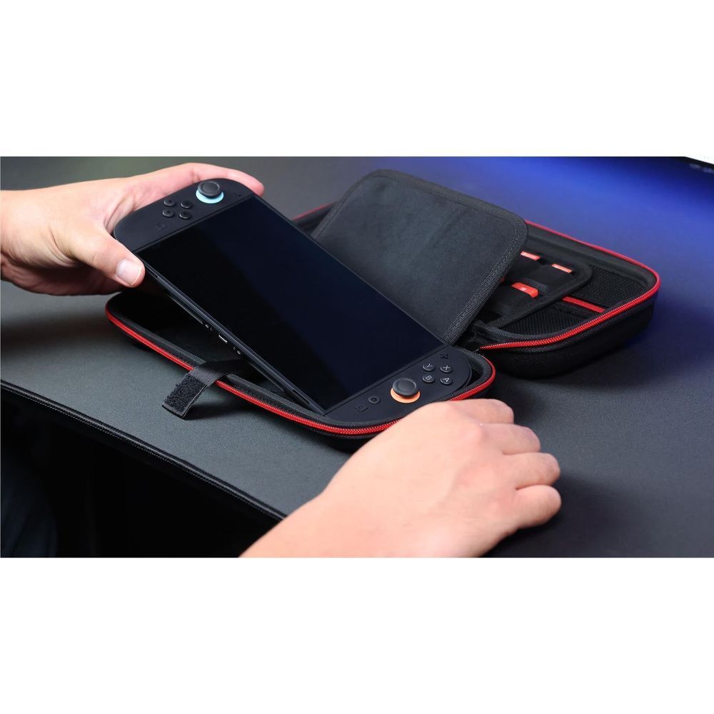 Black carry case holding Nintendo Switch 2 console in molded slots with strap