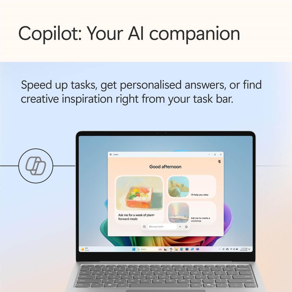 Platinum Surface Laptop showing Copilot-style assistant chat on the touchscreen